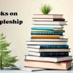 A stack of books on the topic of discipleship, with titles and authors visible. The books are neatly arranged, showcasing various perspectives and insights on the practice and principles of discipleship.