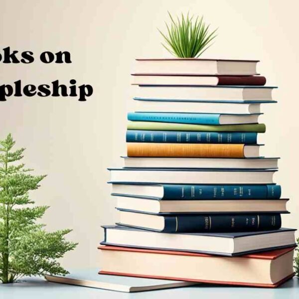 A stack of books on the topic of discipleship, with titles and authors visible. The books are neatly arranged, showcasing various perspectives and insights on the practice and principles of discipleship.