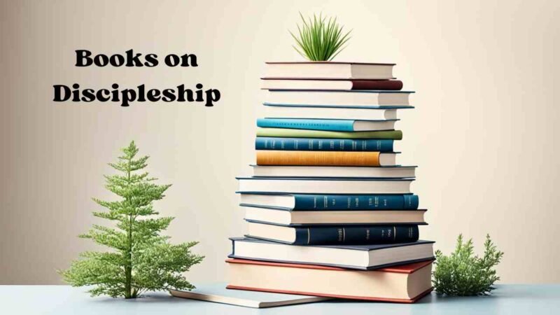 A stack of books on the topic of discipleship, with titles and authors visible. The books are neatly arranged, showcasing various perspectives and insights on the practice and principles of discipleship.