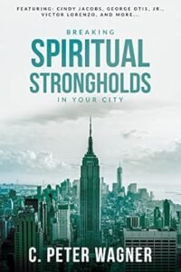 Book cover of Breaking Spiritual Strongholds in Your City by C. Peter Wagner, about transforming cities through prayer.